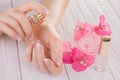 Woman applying perfume on her wrist