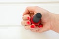 Woman applying red nail polish manicure. Female hand Royalty Free Stock Photo