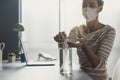 Woman applying sanitizer on her hands