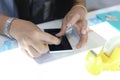 Woman applying a screen protector on an cellphone Royalty Free Stock Photo