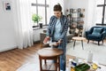 woman applying solvent to rag at home