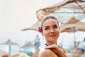 Woman Applying Sun Cream Creme on tanned shoulder.Sun protection.Sun Protection, girl using sunscreen to safe her skin healthy.Ski Royalty Free Stock Photo