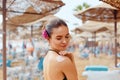 Woman Applying Sun Cream Creme on tanned shoulder.Sun protection.Sun Protection, girl using sunscreen to safe her skin healthy.Ski Royalty Free Stock Photo