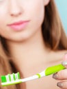 Woman applying toothpaste on her toothbrush Royalty Free Stock Photo