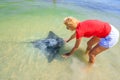 Woman approaches Eagle Ray