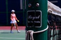 Woman Approaches Tennis Net