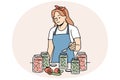 Woman in apron canning vegetables in bottles