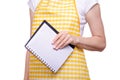 Woman in apron in hands notebook recipes Royalty Free Stock Photo