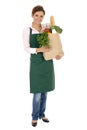 Woman in apron holding grocery bag Royalty Free Stock Photo