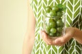 Woman in apron holds jar of gooseberry, close up Royalty Free Stock Photo