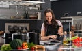 Woman in apron on modern kitchen Royalty Free Stock Photo