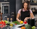 Woman in apron on modern kitchen Royalty Free Stock Photo