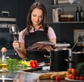 Woman in apron on modern kitchen Royalty Free Stock Photo