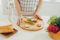 Woman apron preparing a breakfast in the kitchen