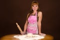 Woman in apron preparing dough