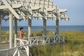 Woman On Arbor Looking at Sea