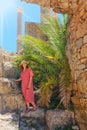 Woman among archaeological excavations at the base of Anthony terms, ancient roman building. Ruins of Carthage antique times of