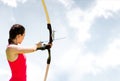Woman archery against sky Royalty Free Stock Photo