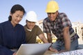 Woman With Architects Using Laptop Royalty Free Stock Photo