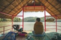 Woman in Area of Huai Krathing reservoir with bamboo raft shelter Royalty Free Stock Photo