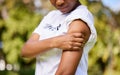 Woman, arm injury and pain in nature from accident, tension or outdoor muscle cramp. Closeup of female person or Royalty Free Stock Photo