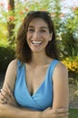 Woman with Arms Crossed outdoors front view portrait.