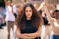 Woman, arms crossed and protest crowd in street for planet, climate change or sustainable future. Girl, leadership Royalty Free Stock Photo