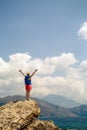 Woman with arms outstretched celebrate mountains sunrise Royalty Free Stock Photo