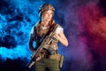 Woman in army pros and cons.Beautiful woman in military ammunition and weapon. Royalty Free Stock Photo