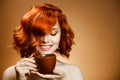 Woman with an aromatic coffee in hands