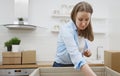 Woman arranges kitchen utensils