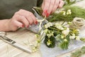 Woman arranging a bunch of mistletoe