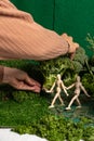 Woman art director building a miniature world