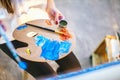 Woman artist mixing oil colours on palette holding in her hand Royalty Free Stock Photo