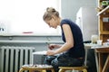 Woman artist making glass jewelry in her worksho Royalty Free Stock Photo