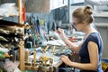 Woman artist making glass jewelry in her workshop Royalty Free Stock Photo