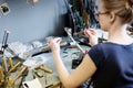 Woman artist making glass jewelry in her workshop Royalty Free Stock Photo