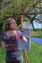 Woman artist painting summer landscape Royalty Free Stock Photo