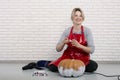 A woman artist prepares for halloween and paints pumpkins Royalty Free Stock Photo