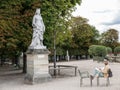 Woman artist sketches statue in Jardin de Luxembourg