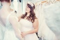 Woman as bride to be looking for bridal wear in a wedding shop Royalty Free Stock Photo