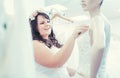 Woman as bride to be looking for bridal wear in a wedding shop Royalty Free Stock Photo