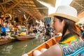 Asian woman looking at vendors pedlar