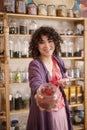 Woman asian seller in a tea shop offers her goods