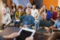 Woman Asking Question At Group Neighborhood Meeting In Community Center Royalty Free Stock Photo