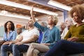 Woman Asking Question At Neighborhood Meeting In Community Center Royalty Free Stock Photo