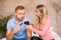 Woman asks her man to explain his messages Royalty Free Stock Photo