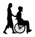Woman assistant disabled man in wheelchair vector silhouette isolated on white. Injured person with help . Health care activity.
