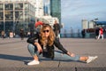 Woman athlete or dancer split leg in paris, france. Sensual woman with long hair in sunglasses and jeans, fashion. Yoga, pilates, Royalty Free Stock Photo