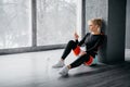 Young slim woman listens music on player in gym Royalty Free Stock Photo